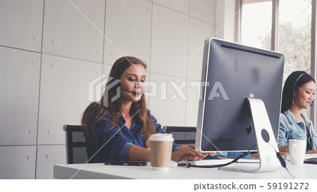 Customer support agent or call center with headset Customer support agent or call center with headset 59191272