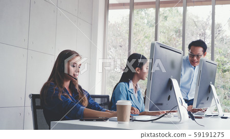 Customer support agent or call center with headset Customer support agent or call center with headset 59191275