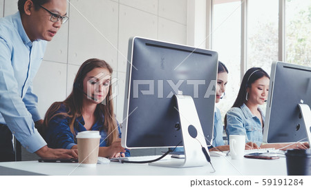 Customer support agent or call center with headset 59191284