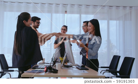 Successful business people celebrating success. 59191303