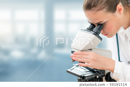 Scientist researcher uses microscope in laboratory 59191514