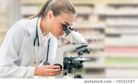 Scientist researcher uses microscope in laboratory 59191587