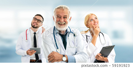 Doctor working in hospital with other doctors. Doctor working in hospital with other doctors. 59191923