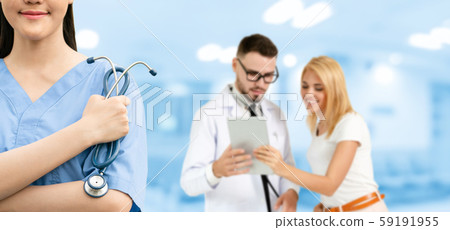 Doctor working in hospital with other doctors. Doctor working in hospital with other doctors. 59191955