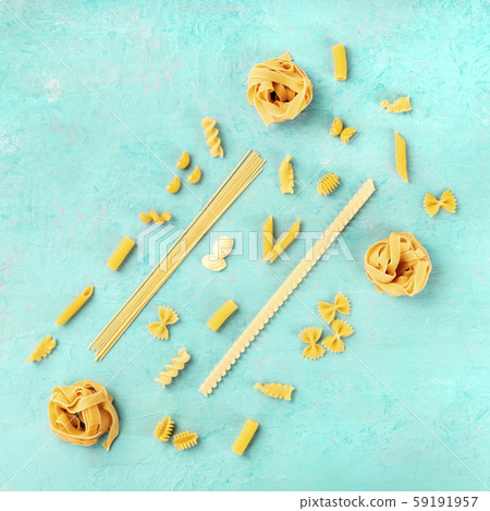 Italian pasta of various types, a square flatlay banner, shot from the top on a teal blue background 59191957
