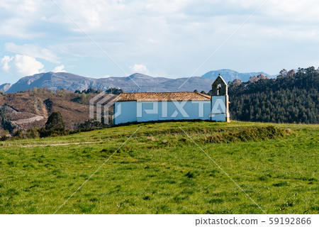 Small chapel in meadow against the mountains Small chapel in meadow against the mountains 59192866