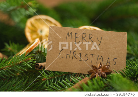 merry christmas card on spruce twigs with decorations 59194770
