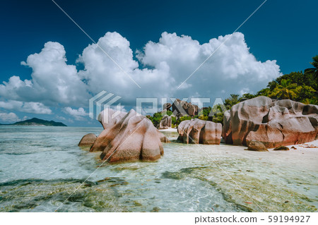 Anse Source d'Argent -amazing tropical beach with huge granite boulders and shallow blue lagoon on Anse Source d'Argent -amazing tropical beach with huge granite boulders and shallow blue lagoon on 59194927