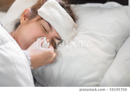 Sick asian woman have hight fever flu and illness 59195709