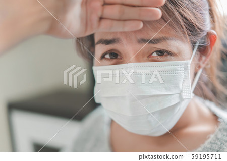 Sick asian woman have hight fever flu and man Sick asian woman have hight fever flu and man 59195711