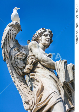 One of the angel statues on the Angel bridge over One of the angel statues on the Angel bridge over 59196328