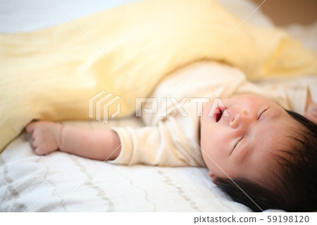 Yawning young baby 59198120