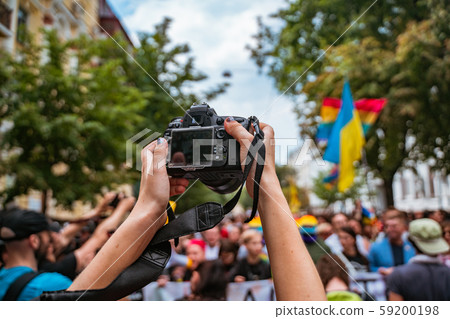 Correspondent takes photo during the Gay Pride parade 59200198