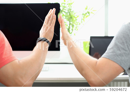 Two male hand in office hive five Two male hand in office hive five 59204672