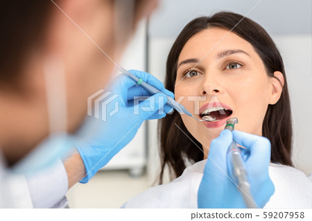 Close up of female patient during treatment at dentist 59207958