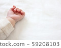 Baby hand 59208103