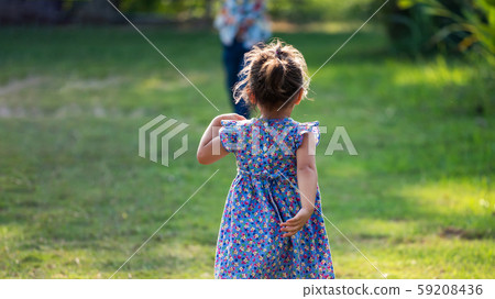 rear girl running on field with brother 59208436