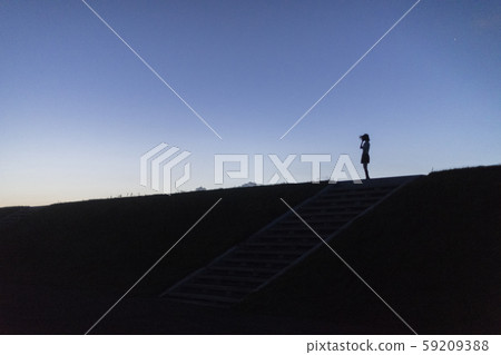 High school girl watching the sea on the hill 59209388