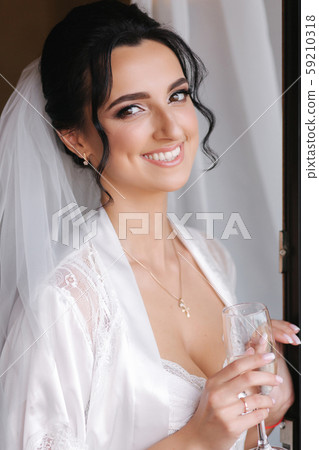 Close up portrait of gorgeous bride at hotel in morning. Charming woman with great hairstyle and Close up portrait of gorgeous bride at hotel in morning. Charming woman with great hairstyle and 59210318