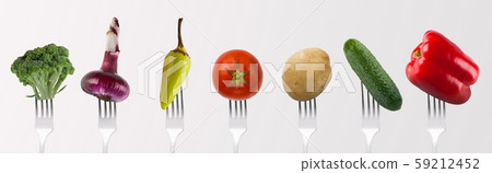 Collage of fresh vegetables for lunch on forks on gray Collage of fresh vegetables for lunch on forks on gray 59212452