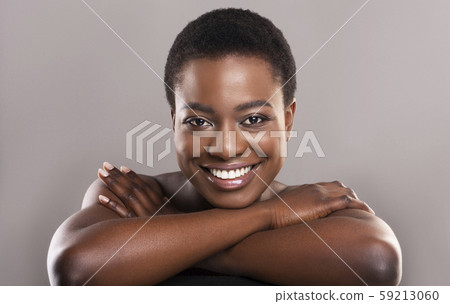 Beautiful nude black woman with flawless skin and charming smile Beautiful nude black woman with flawless skin and charming smile 59213060