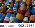 Weathered colorful old lobster buoys 59213362