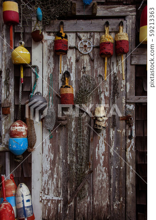 Door with fishnets and lobster buoys 59213363