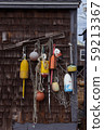 Lobster buoys hanging on a wooden barn wall 59213367