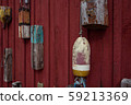 Old retro lobster buoys on the red wall 59213369