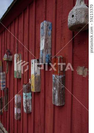 Red boat house wall in Rockport harbor 59213370