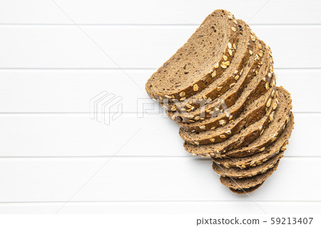 Sliced whole grain bread with oat flakes. Sliced whole grain bread with oat flakes. 59213407