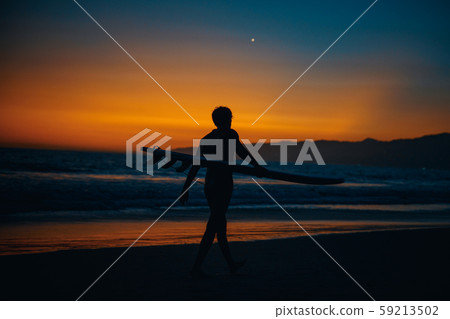 Sunset on the Pacific Coast in California, surfer and joggers run a sport Sunset on the Pacific Coast in California, surfer and joggers run a sport 59213502