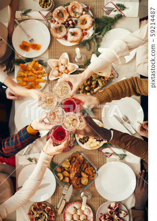 Toasting over Dinner Table 59214487