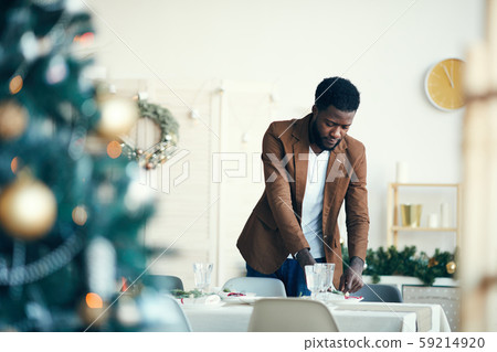 Man Preparing for Christmas Dinner Man Preparing for Christmas Dinner 59214920