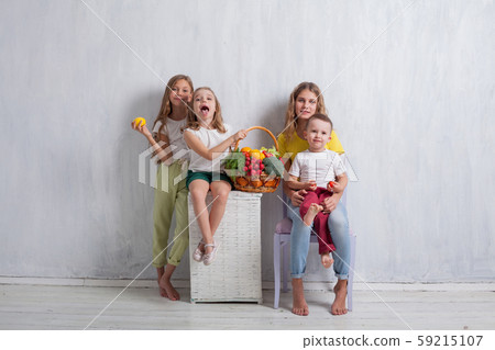 beautiful kids friends family with a basket ofvegetables and fruits beautiful kids friends family with a basket ofvegetables and fruits 59215107