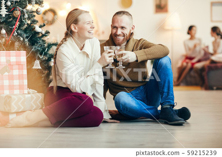Happy Couple by Christmas Tree 59215239