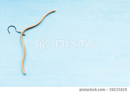 old wooden hangers for fashionable things on the background 59215829