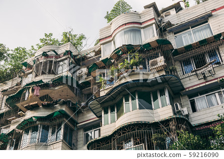 Windows and balconies of old residential buildings 59216090