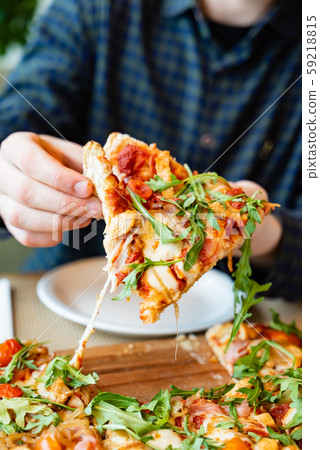 tasty pizza in the pizzeria 59218815