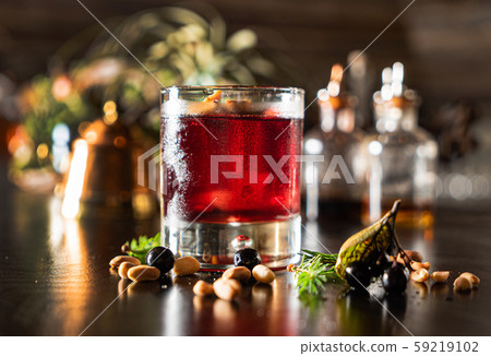 Christmas berries cocktail on the table 59219102