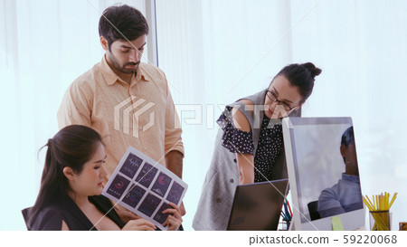 Unhappy business people in group meeting. Unhappy business people in group meeting. 59220068