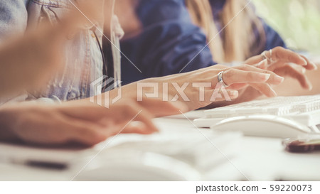 Businesswoman hand typing on computer at desk. Businesswoman hand typing on computer at desk. 59220073