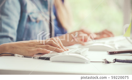 Businesswoman hand typing on computer at desk. Businesswoman hand typing on computer at desk. 59220075