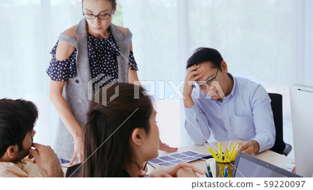 Unhappy business people in group meeting. Unhappy business people in group meeting. 59220097