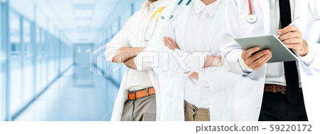 Doctor working in hospital with other doctors. Doctor working in hospital with other doctors. 59220172