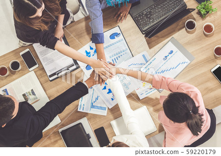 Teamwork business people join hands in meeting. Teamwork business people join hands in meeting. 59220179