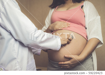 Pregnant Woman and Gynecologist Doctor at Hospital 59220423