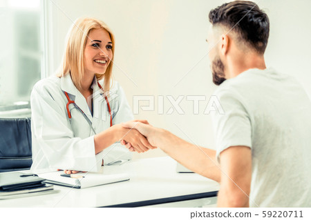 Doctor shake hand with patient in the hospital. Doctor shake hand with patient in the hospital. 59220711