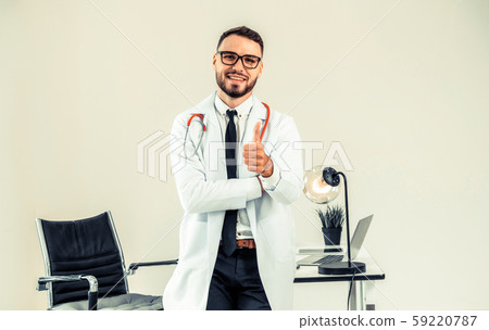 Doctor showing thumbs up in the hospital. 59220787