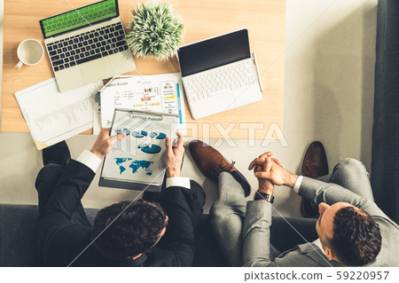 Businessmen are in business meeting in office. 59220957